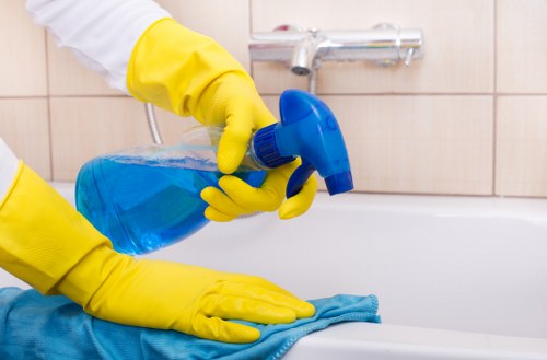 Local cleaner tidying a kitchen in Twickenham